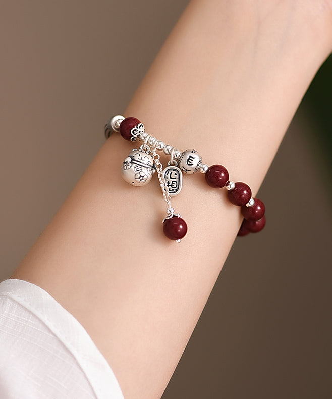 Mulberry Sterling Silver Cinnabar Tassel Charm Bracelet