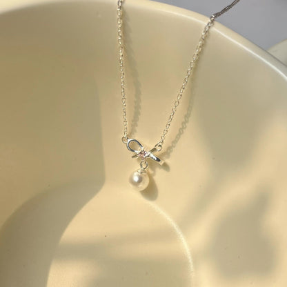 Cady Bow and Pearl Necklace